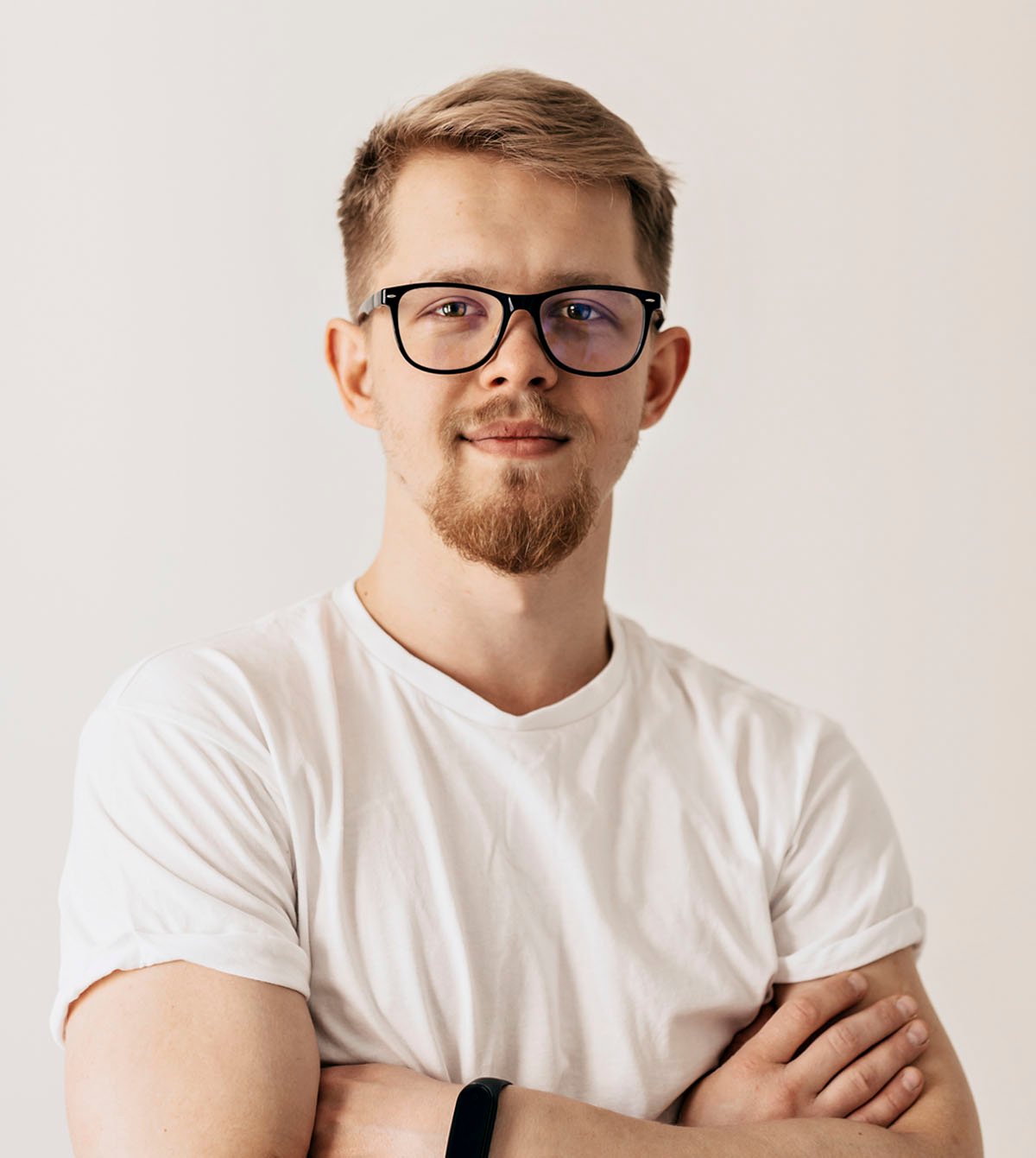 inside portrait of confident young man in white cl 2 3PVKGN2